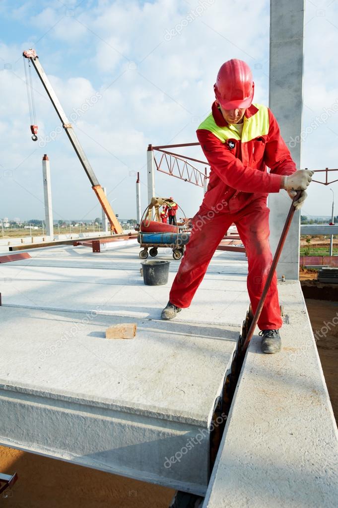 Builder worker installing concrete slab