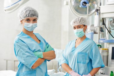 Surgery nurses team in clinic clipart