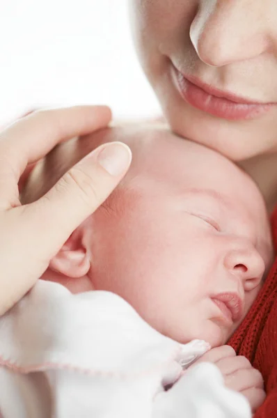 Newborn baby under adult hand protection — Stock Photo, Image