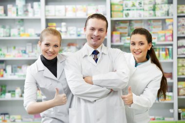 Pharmacy chemist group in drugstore clipart