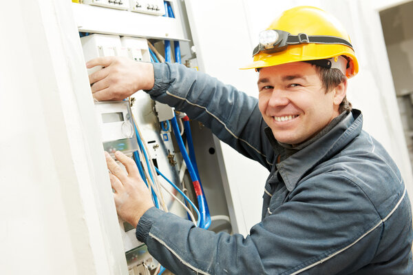 Electrician installing energy saving meter