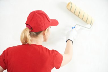 Woman painter at indoor work clipart