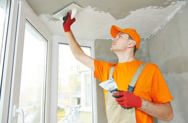 Plasterer at indoor ceiling work clipart