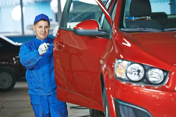 Auto mechanic at repair bodywork Stock Photo