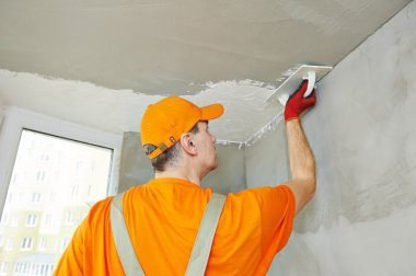 Plasterer at indoor ceiling work clipart