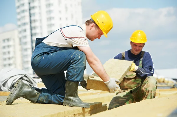 Roofer worker installing roof insulation material — Stock Image Roofer worker installing roof insulation material Stock Picture