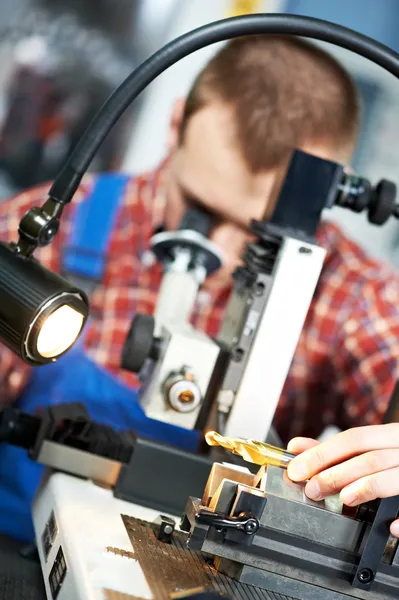 Worker checking tool with optical device — Stock Photo, Image