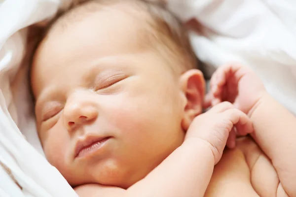 Newborn baby in bedsheet — Stock Photo, Image