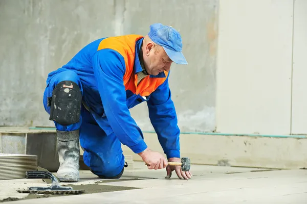 Tilers at industrial floor tiling renovation — Stock Photo, Image