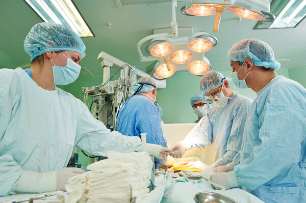 Surgeons team at cardiac surgery operation