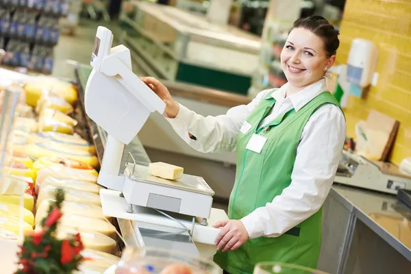 Saleswoman in supermarket shop — Stock Photo, Image