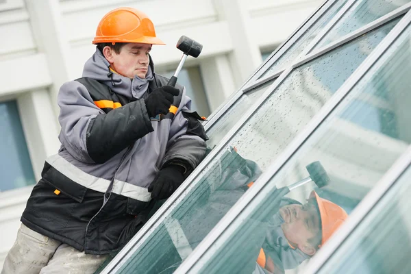 Worker installing window — Stock Photo, Image