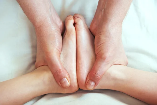 Masseur massaging a child leg — Stock Photo, Image