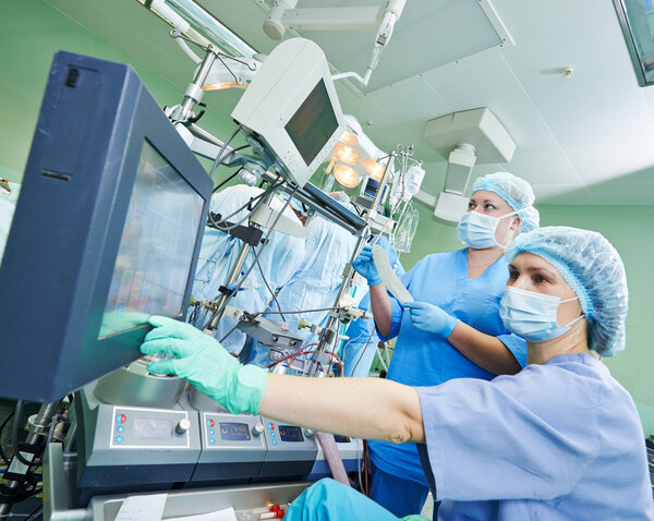 Surgery nurse working during operation