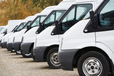 Commercial vans in row clipart