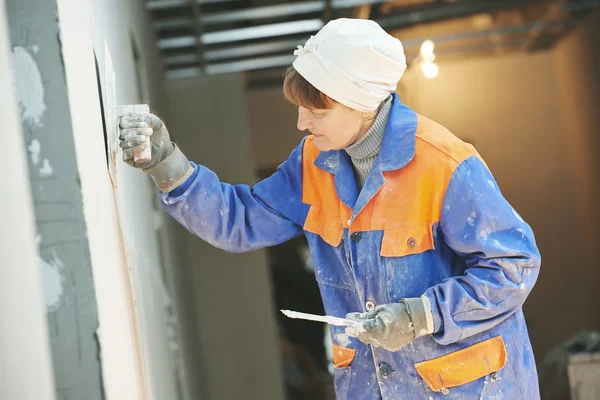 Plasterer at indoor wall work — Stock Photo, Image