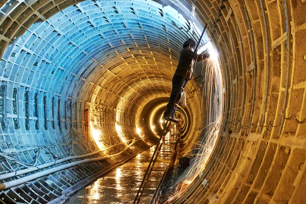 Welder at underground subway construction site — Stock Photo, Image