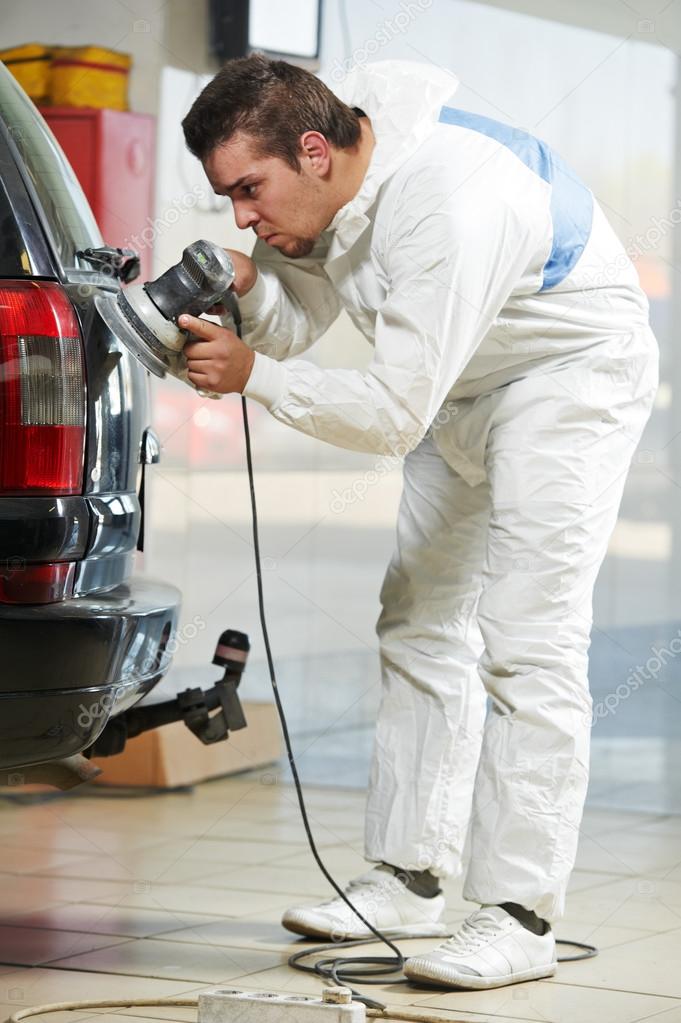 Auto mechanic polishing car