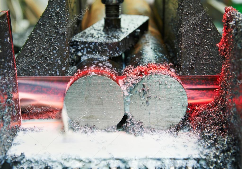 Close-up process of metal machining by saw