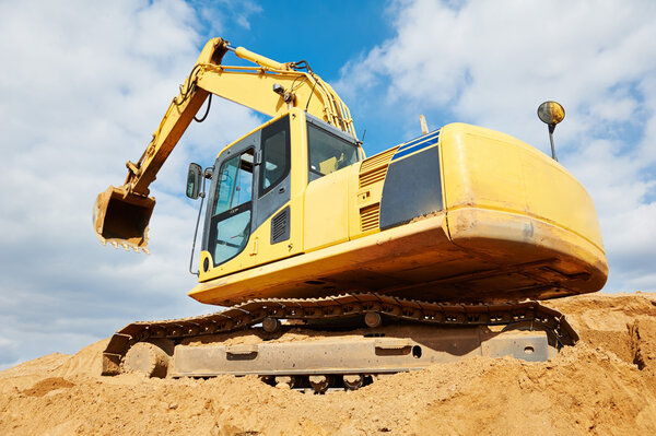 Excavator loader at earthmoving works
