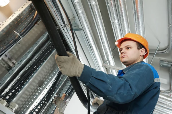 Two electrician workers at cabling Stock Photo by ©kalinovsky 187334206