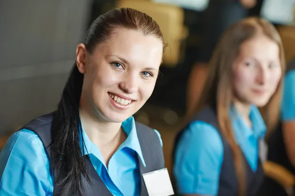 Hotel worker on reception or help desk — Stock Photo, Image