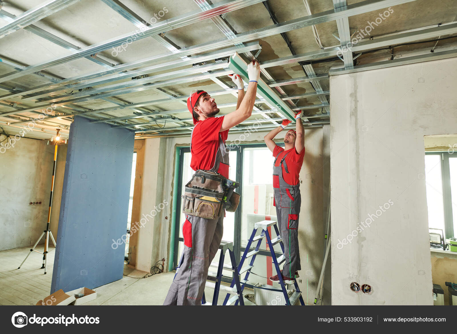 Gypsum plasterboard work. Drywall construction at home. Contractor worker  installing metal frame on ceiling — Stock Photo © kalinovsky #533903192, image size:1600x1167