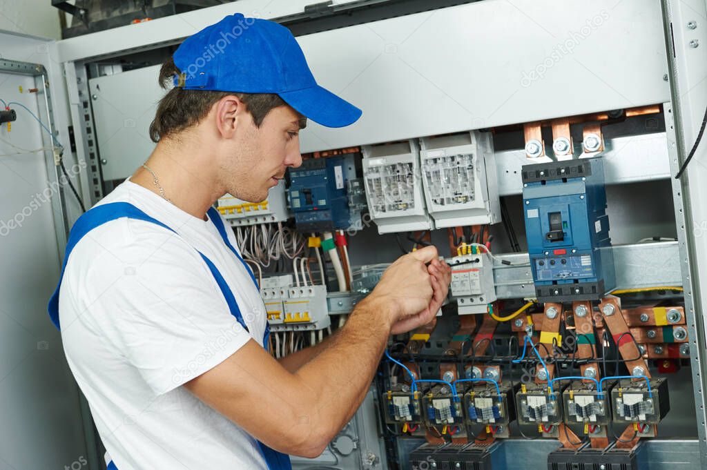 electrician engineer worker replacing electrical equipment for repair