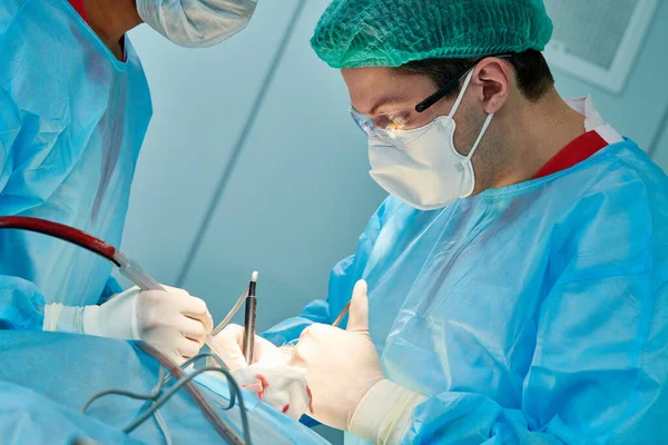 Emergency surgery. Surgeons during surgical intervention in clinic — Stock Photo, Image