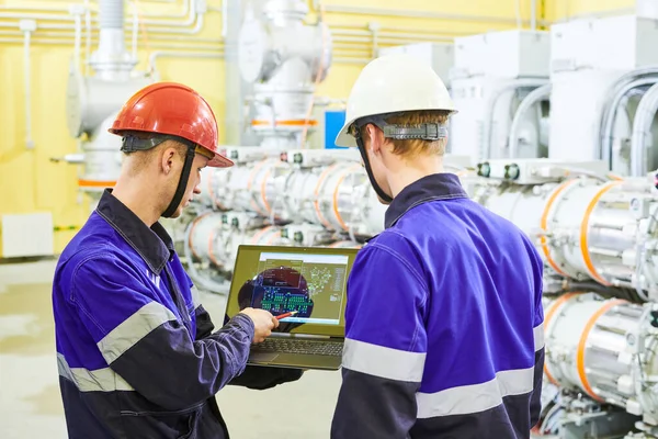 Industrial technicians works at power energy supply factory — Stock Photo, Image