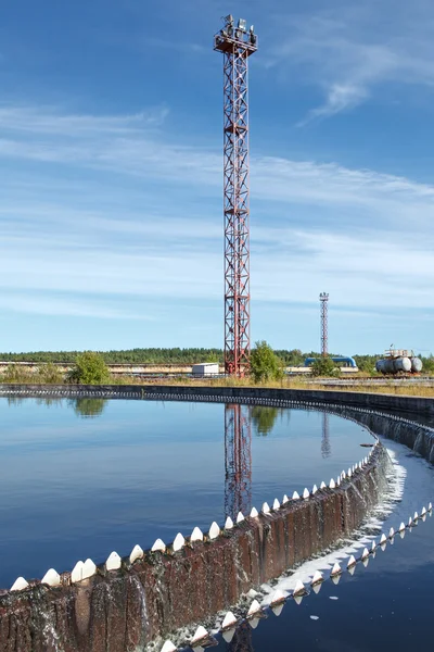 Blue sky reflection in sedimentation settler on treatment plant — Stock Photo, Image