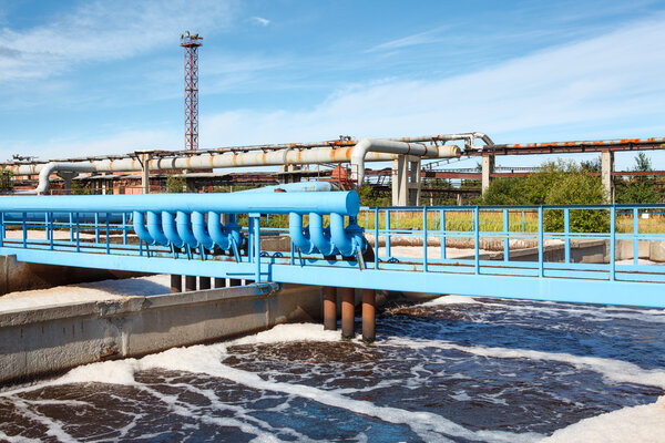Water treatment plant view with chimney and blue sky