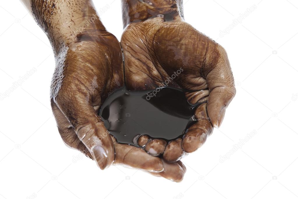 Oil in hands on white background