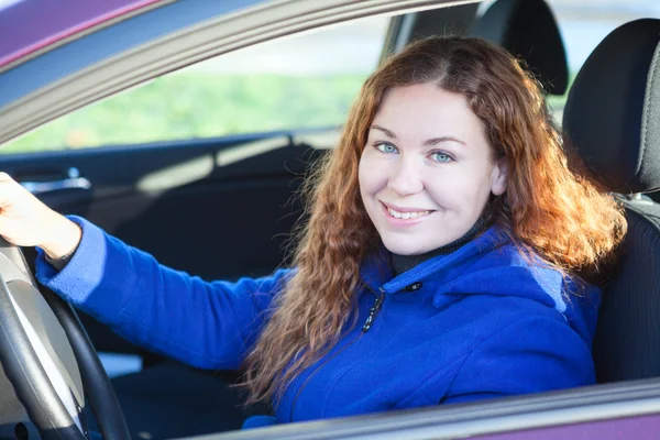 Smiling young woman the driver — Stock Photo, Image