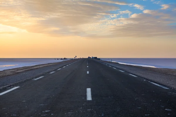 Sunset in solt lake in early morning in empty road, Tunisia — Stock Photo, Image