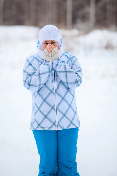 Happy Caucasian woman portrait with warming frozen hands in winter — Stock Photo, Image