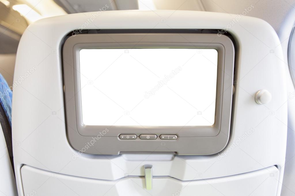 Comfortable seat in cabin of aircraft with screen in chair back