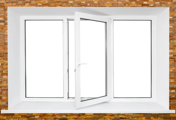 Plastic triple door window over bricks — Stock Photo, Image
