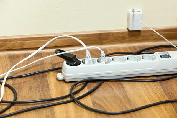 Electrical cords on floor — Stock Photo, Image