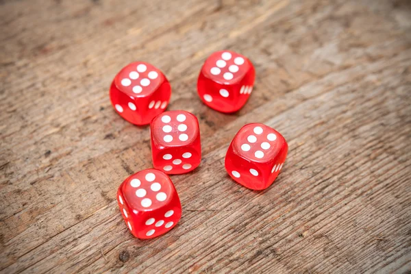 Dices on wooden floor — Stock Photo, Image