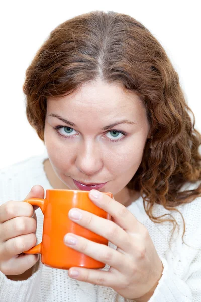 Woman with from orange mug Royalty Free Stock Images