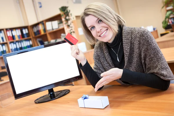 Woman with gift purchased over the Internet — Stock Photo, Image