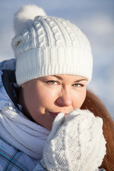 Portrait of woman in hat and mittens Stock Picture