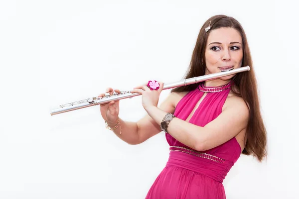 Woman plays on flute — Stock Photo, Image