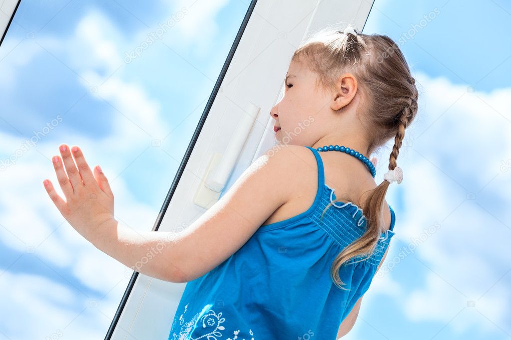 Girl behind plastic window