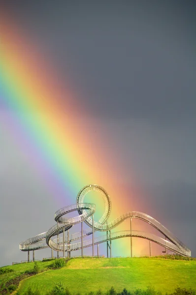 Rainbow over roller coaster — Stock Photo, Image