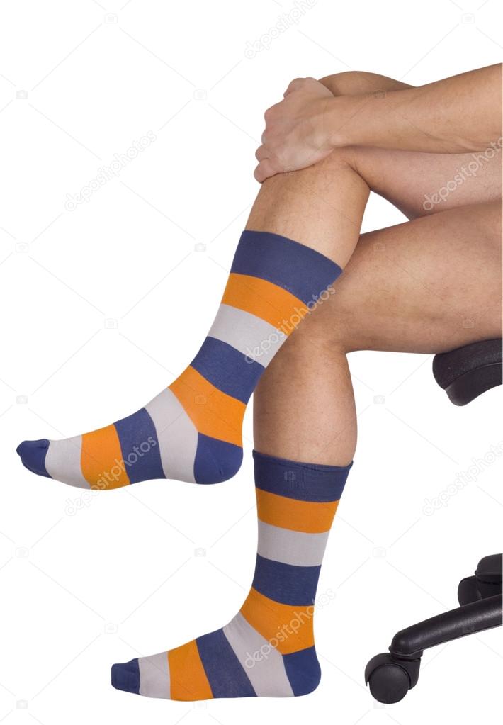 Male legs in colorful socks. Isolated on white