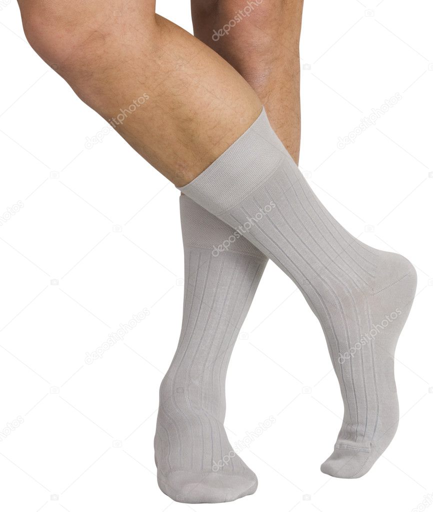 Male legs in socks. Isolated on white background