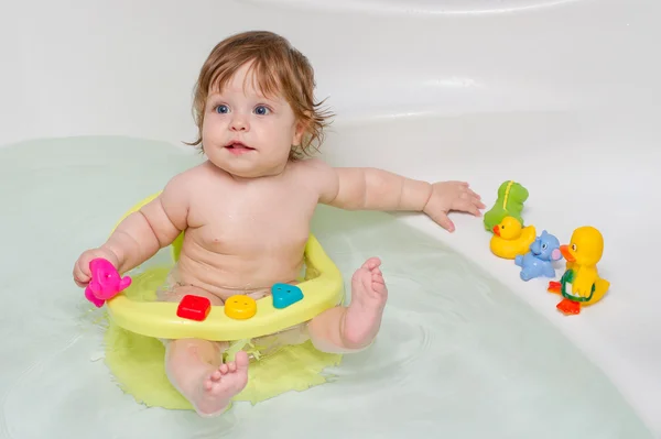 Cheery cute baby girl in a bath — Stock Photo, Image