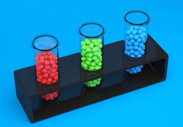 Reagenzgläser mit roten, grünen und blauen Kugeln — Stockfoto